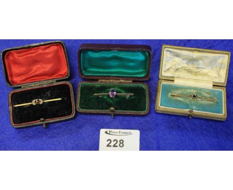 Three 9ct gold bar brooches, sapphire, garnet and amethyst.