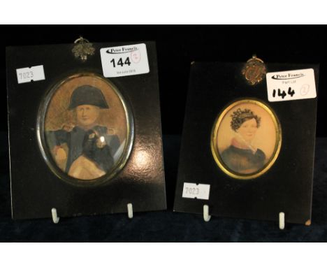 Two 19th century portrait miniatures one of Admiral and another of Lady in oval gilt frames within ebonized borders. Believed