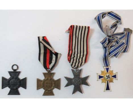 Selection of German Medalsconsisting WW2 German Mothers Cross in gilt and enamel ... Bronzed 1914-1918 Cross Of Honour ... Si