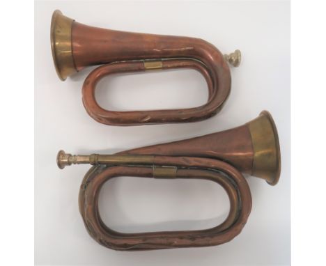 Two WW1 1915 Dated Military Buglescopper and brass military bugles with white metal mouthpieces.  Lower part of bugles with m