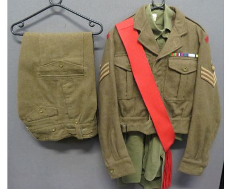 1949 Pattern Battledress Uniformconsisting khaki woollen, single breasted, open collar, short jacket.  Pleated chest pockets 