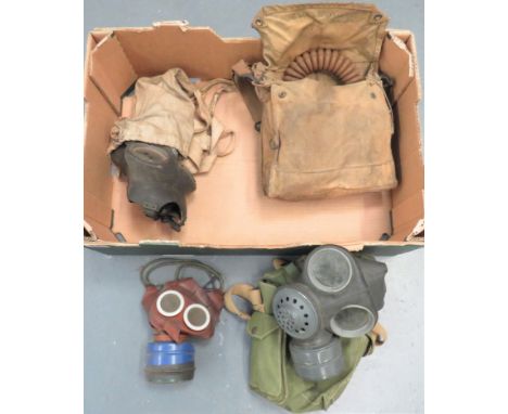 Small Selection of British Respiratorsconsisting 1939 dated, hose mask complete in transit bag ... Mickey Mouse child's mask 