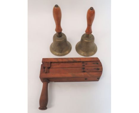 Small Selection of ARP Itemsconsisting wooden alarm rattle.  Broad arrow stamped ... Two brass handbells stamped "ARP" and ma