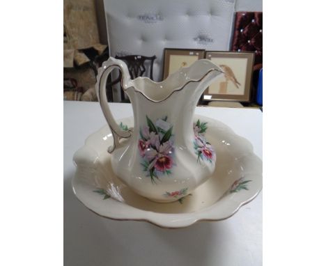 An ironstone wash jug and basin 