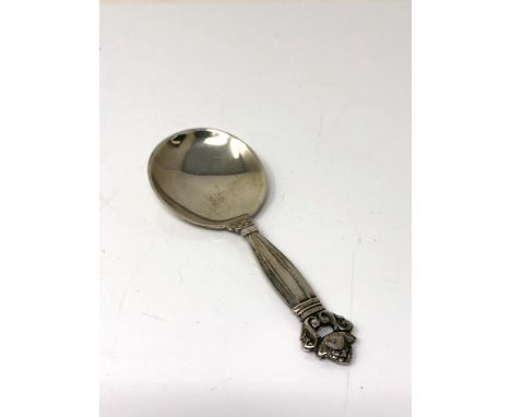 A Georg Jensen silver acorn pattern caddy spoon 