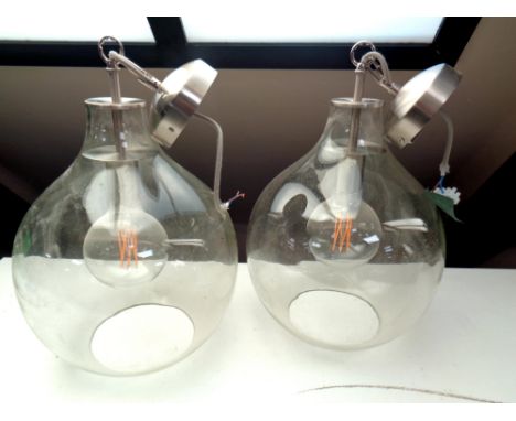 Two contemporary pendant light fittings with glass shades 