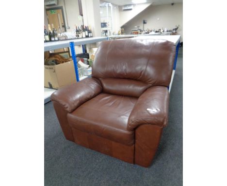 A brown leather manual reclining armchair 