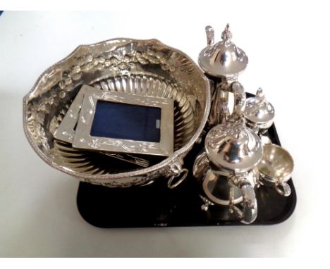 A tray containing a large silver plated lion mask handled punch bowl together with a four piece Viners plated tea service  