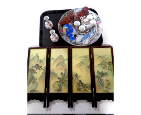 A tray containing oriental wares to include a four way folding screen, carved wooden figures, six piece miniature tea service