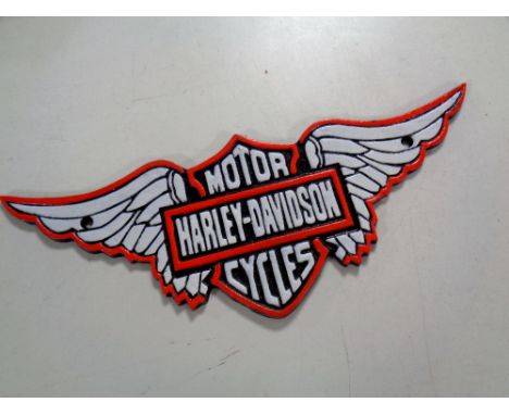 A cast iron plaque, Harley Davidson 