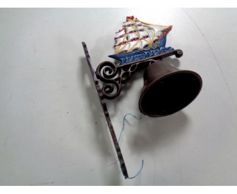 A cast iron ship wall bracket with bell 