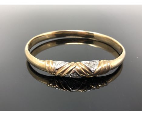 A 9ct gold diamond set bangle CONDITION REPORT: 9.25g