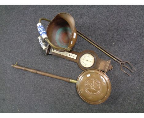 A copper and brass porcelain handled coal bucket together with a fire poker and toasting fork, a copper wooden handled bed wa