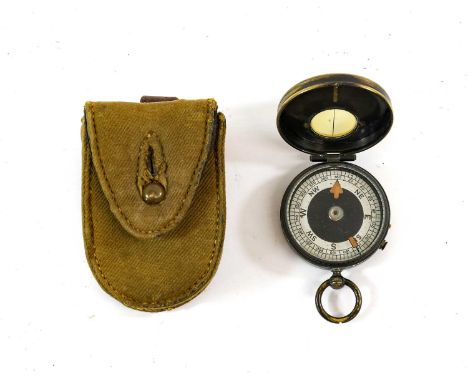 A First World War Non-Prismatic Marching Pocket Compass, the brass case with traces of the original black finish, the free sp