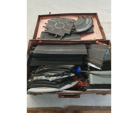 A vintage suitcase containing vintage Scalextric with accessories and controllers etc (untested), shipping unavailable