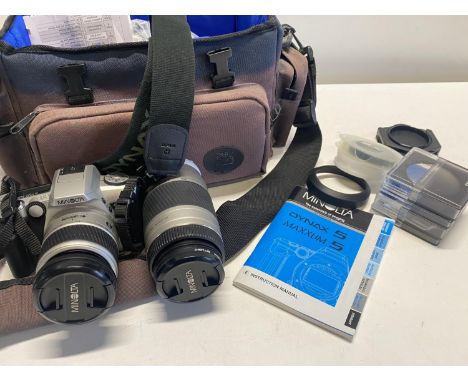 A Minolta Dynax 5 digital camera with lenses and accessories (untested)