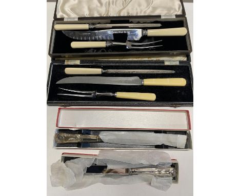 Two boxed vintage carving sets and two other boxed breadknives, UK Post only