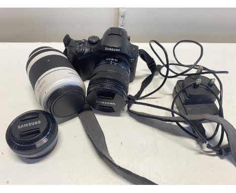 A Samsung NX20 digital camera and lens in working order