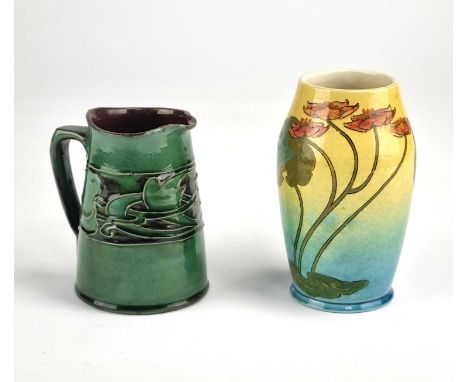 An Ault pottery 'Lilium' Arts &amp; Crafts vase, circa 1890, 14.2cm high and an Art Nouveau CH Brannam Barum jug made for Lib