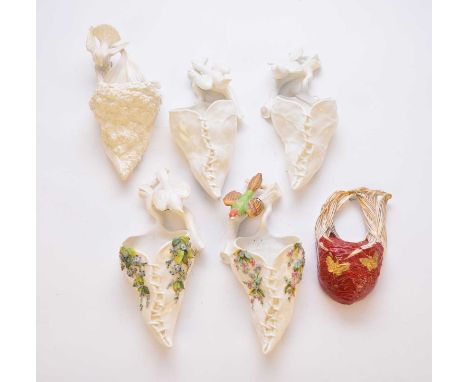 A collection of assorted Royal Worcester wall pocket vases, late 19th century, including an example formed of a red basket wi