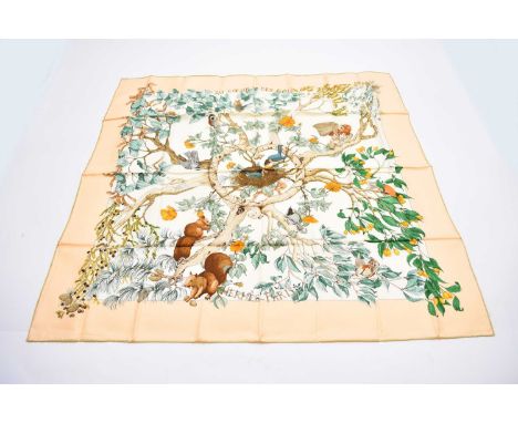 A Hermes silk 'Au Coeur Des Bois' print scarf, designed by Zoe Pauwels, cream border, 88cm x 88cm, with card envelope slipcas
