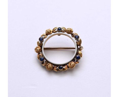 A late 19th/early 20th century sapphire and enamel brooch, designed as six round mixed cut sapphires milligrain set in yellow