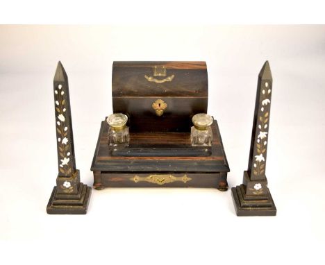 A Victorian faux calamander and ebonised standish, with a correspondence box above two inkwells and a pen tray, with a drawer