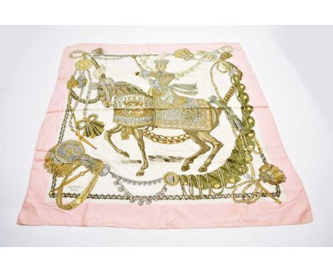 A Hermes silk 'Le Timbalier' print scarf, designed by Francoise Heron, incorporating a figure on horseback within rope swag b