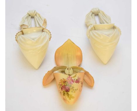 Three Royal Worcester wall pockets, comprising two modelled as swag tied amphora, one with gilt, dated 1886 and 1891, 22cm hi