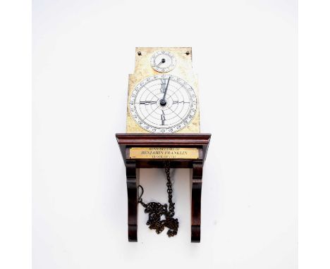 A reproduction Benjamin Franklin wall clock by Thwaites &amp; Reed, the 5.5" lacquered brass arched dial with silvered chapte