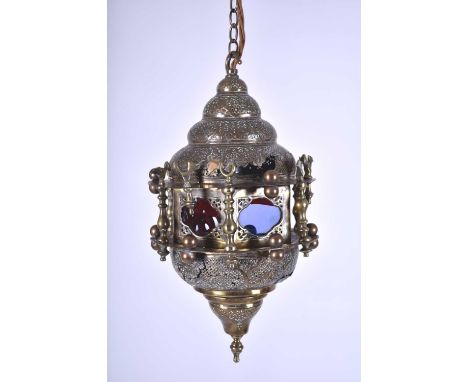 An Ottoman brass hanging lantern, late 19th/early 20th centuryOf double-ogee form with pierced lattice panels containing Arab