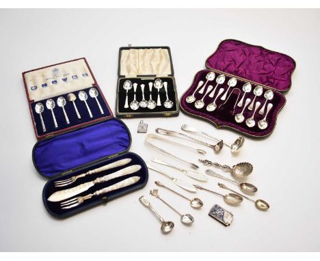 A cased set of twelve silver teaspoons with sugar tongs, James Deakin &amp; Sons, Sheffield 1887 &amp; 1888, together with a 