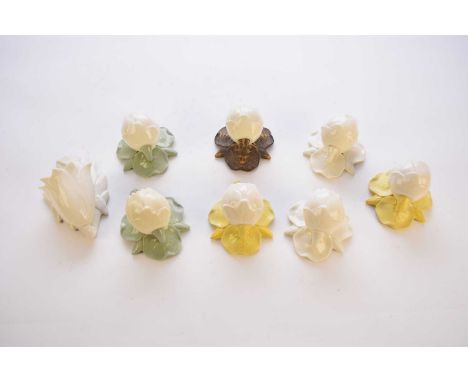 Eight Grainger and Co, Worcester wall pocket vases in the forms of water lilies, including yellow, green and gilt variations,