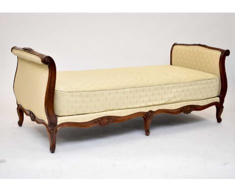 A Louis XV style mahogany day bed by Seventh Heaven, with padded scroll headboard and footboard and padded side rails, the sh