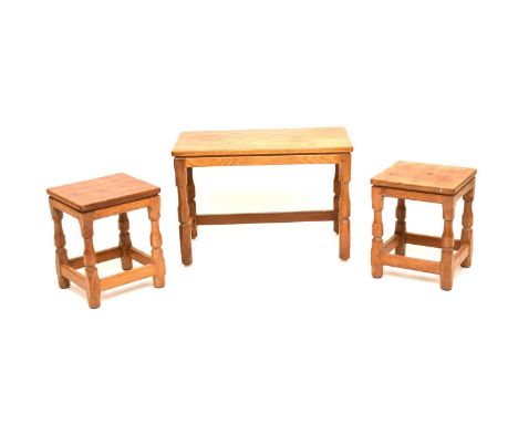 An Old Mill, Thirsk, light oak nesting table set, comprising a rectangular low table with two smaller tables or stools nestin