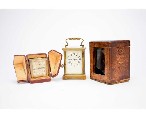 A French brass carriage timepiece, circa 1915, with a 2.75" enamelled dial, with original case and key, engraved with present