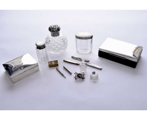 A collection of silver wares, comprising; a silver topped cut glass dressing table bottle, William Comyns, London 1891, two s