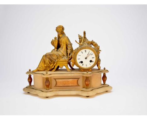 A late 19th century French gilt spelter and alabaster mantel clock, in the form of a classical figure holding an urn and a ca