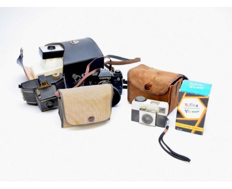 A collection of mid-late 20th century cameras and accessories, including a Contax 35mm SLR, various box cameras, Polaroid lan