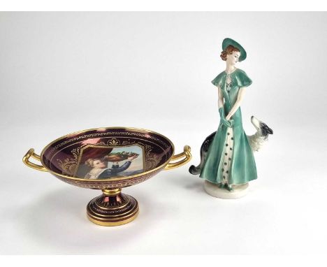 A W. Goebel Art Deco figure of a lady in an elegant green dress with a Borzoi dog, circa 1935-7, impressed WG' mark, model 'F