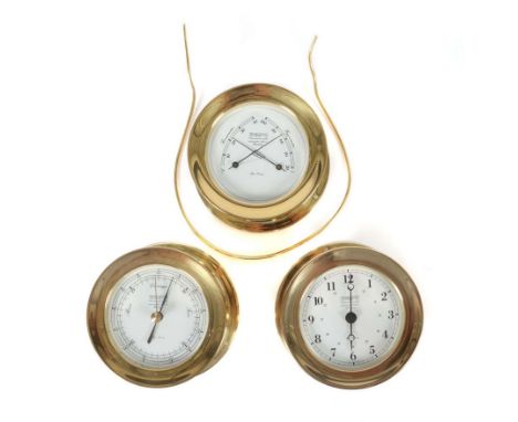 3 maritime InstrumenteWempe, Hamburg, 2. Hälfte 20. Jh., je rund Messinggehäuse mit Schraubdeckel samt Kunststoffeinsatz, The