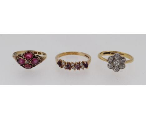 THREE GOLD RINGS comprising 18ct gold &amp; platinum diamond cluster ring, 12ct gold ruby ring and a 9ct gold diamond dress r