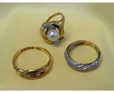 GOLD RINGS comprising 18ct gold ruby and diamond ring (2.7gms), pearl and diamond chip ring (1.5gms), and a 9ct gold diamond 