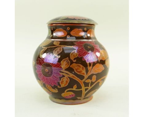 ZSOLNAY PECS FLAMBE LUSTRE JAR &amp; COVER, c. 1924-1970, painted with sunflowers in puce and orange on a chocolate ground, r