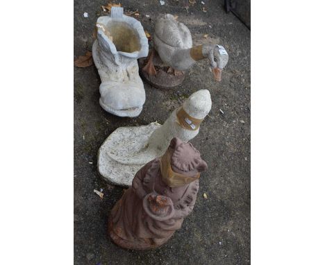 Four garden ornaments to include a boot planter, goose and two others
