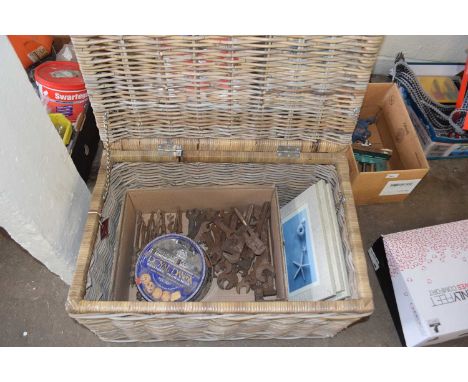 Wicker hamper together with a quantity of assorted spanners, drill bits and other tools