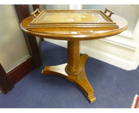 A WALNUT OVAL CENTRE TABLE, on pillar support and tri-form base, approximate size length 90cm x width 70cm x height 74cm