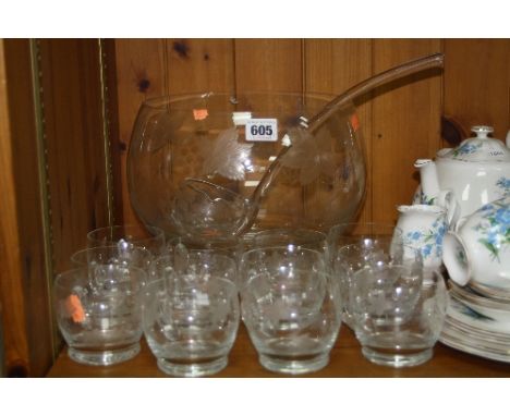 A GLASS PUNCH BOWL AND TWELVE GLASS CUPS, together with a glass ladle