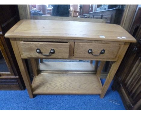 A MODERN LIGHT OAK SIDE TABLE, with two drawers and undershelf, approximate size width 85cm x depth 30cm x height 75cm