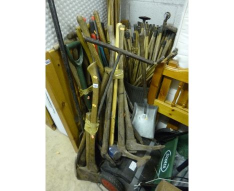 A QUANTITY OF GARDEN TOOLS, to include shovels, axes, etc
